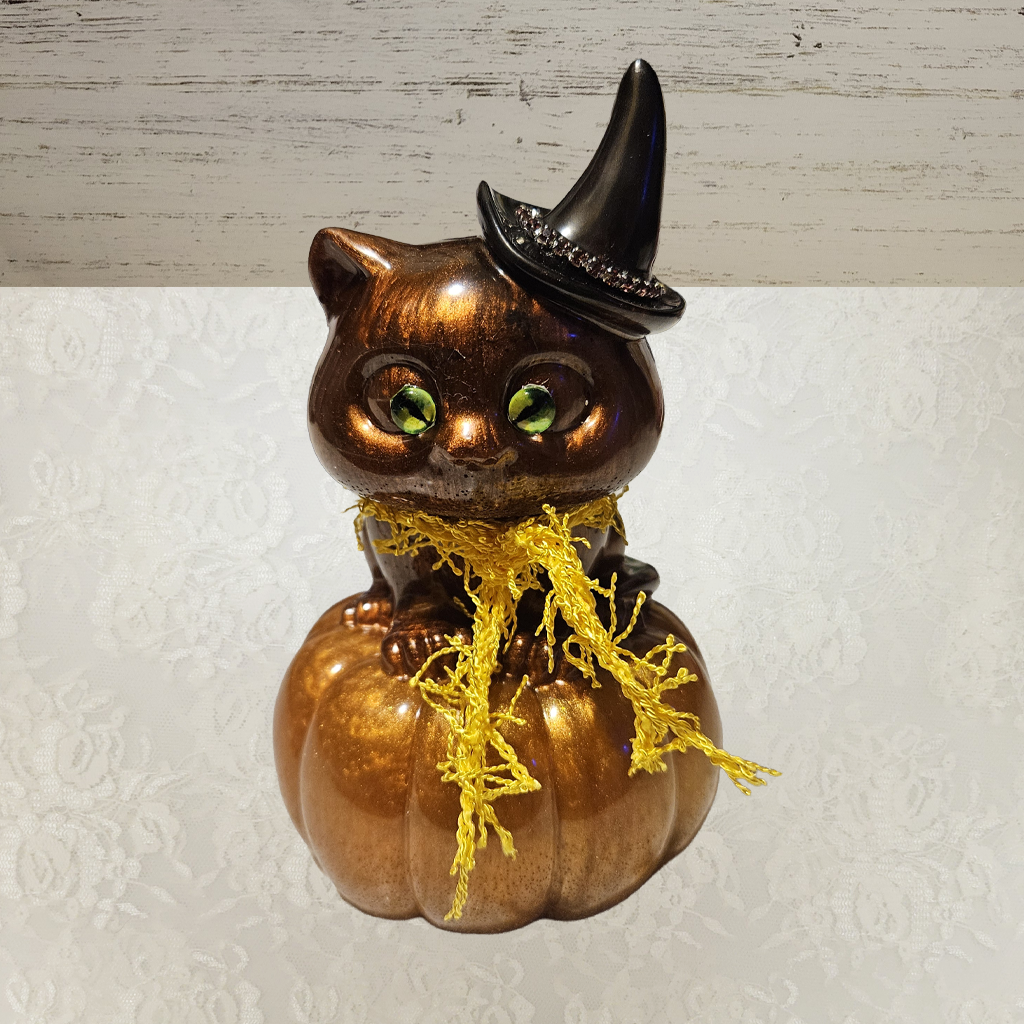 Cat With Witches Hat Sitting On Pumpkin