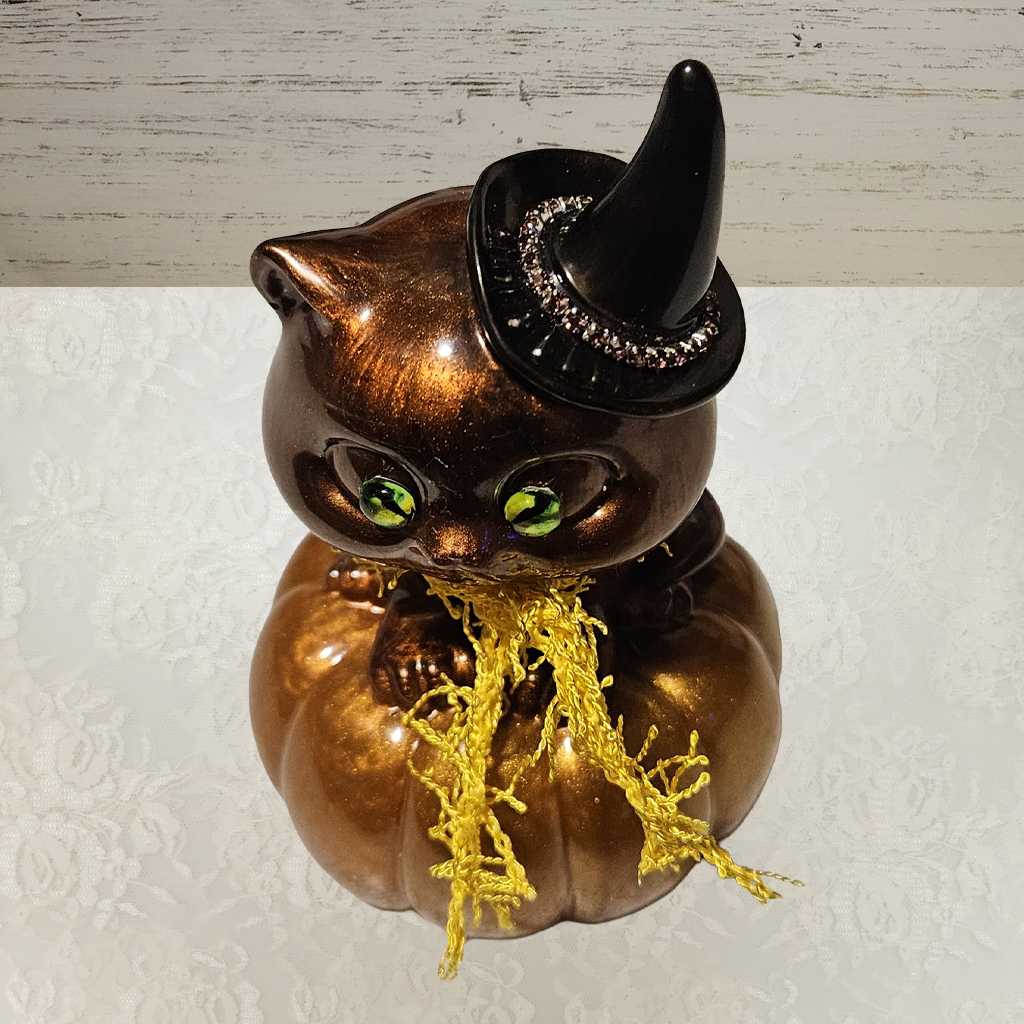 Cat With Witches Hat Sitting On Pumpkin