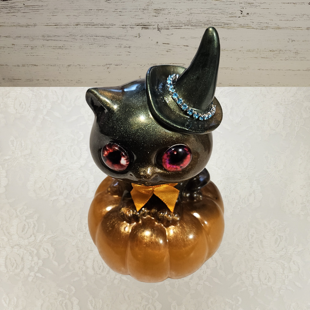 Cat With Witches Hat Sitting On Pumpkin