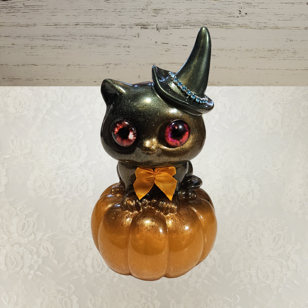 Cat With Witches Hat Sitting On Pumpkin