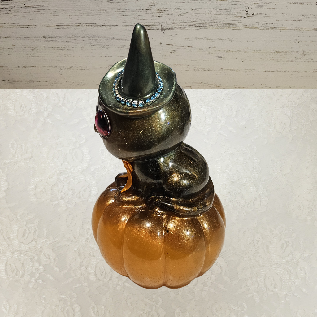Cat With Witches Hat Sitting On Pumpkin