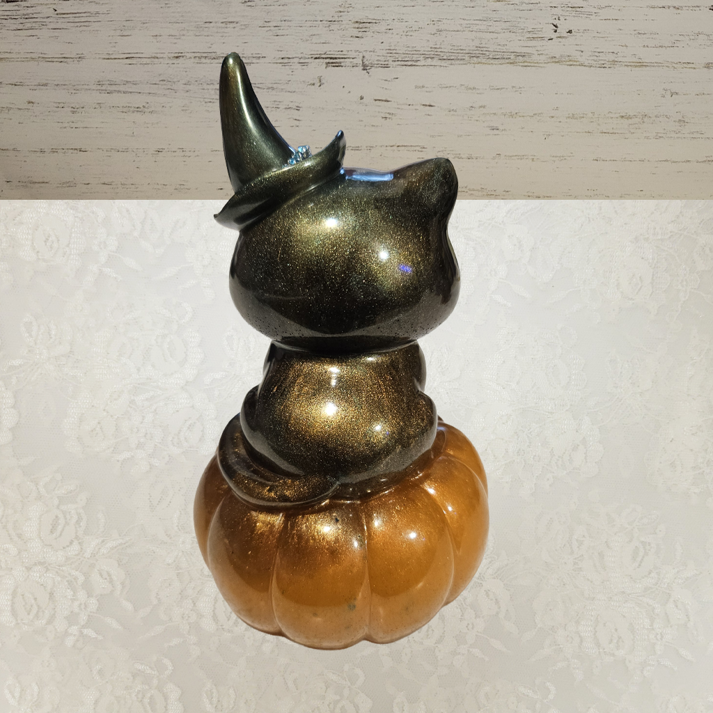 Cat With Witches Hat Sitting On Pumpkin