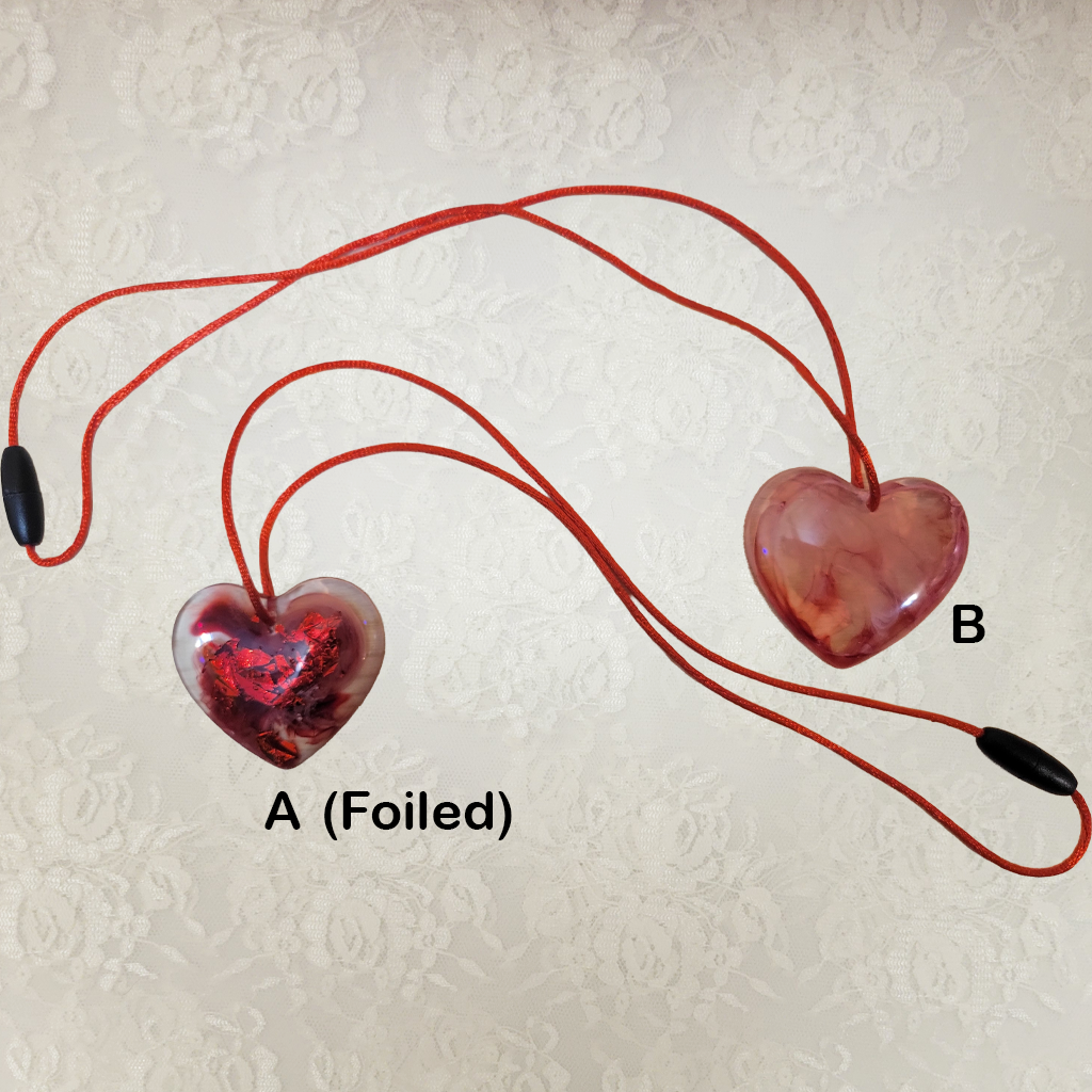 A Valentine Heart Necklace With Red Silk Cord